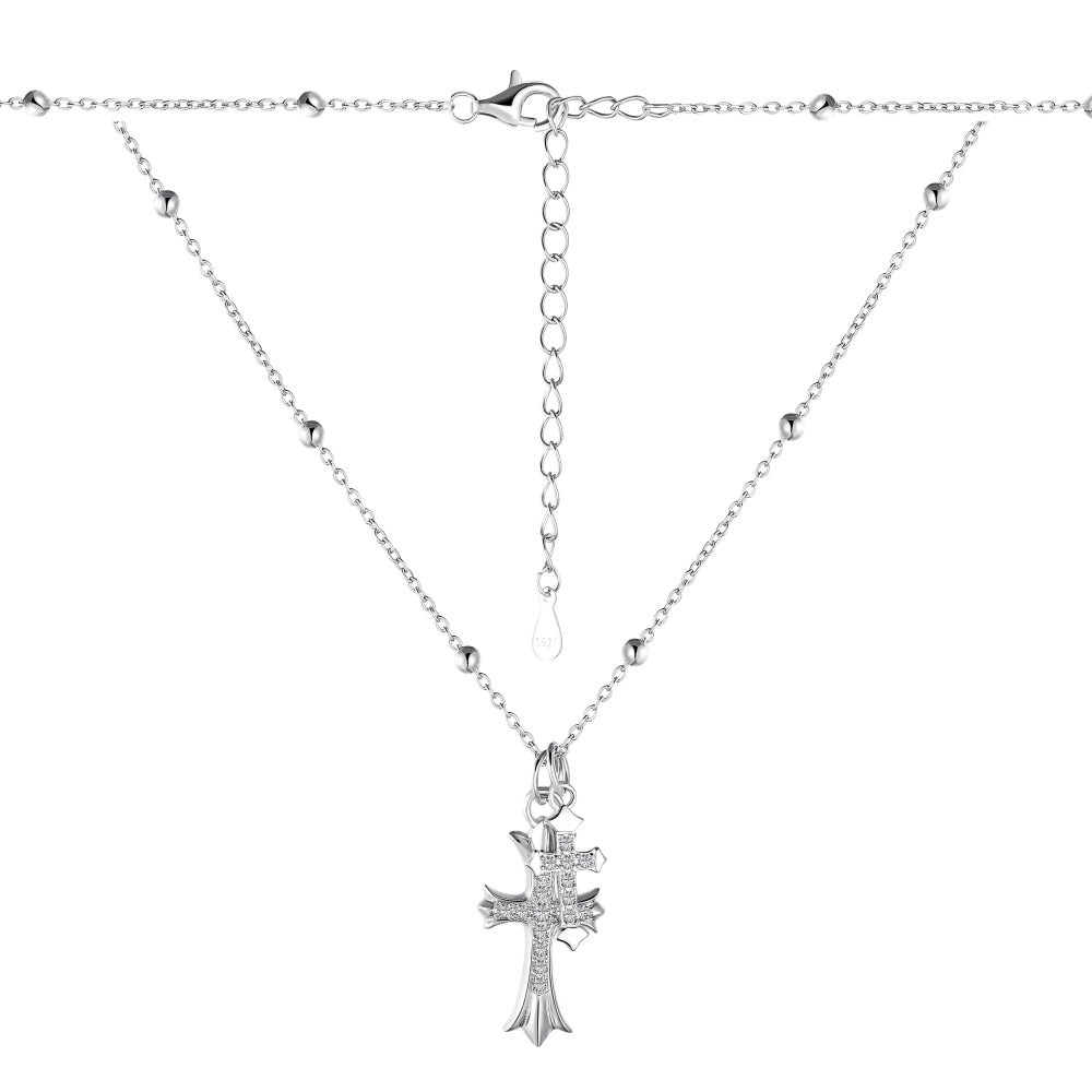 Pendentif double croix sur collier chaîne délicate