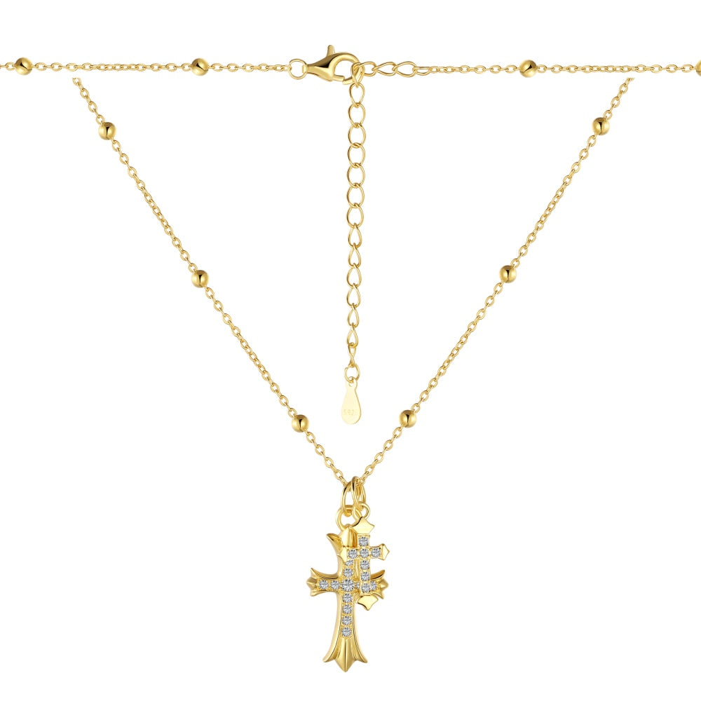 Pendentif double croix sur collier chaîne délicate